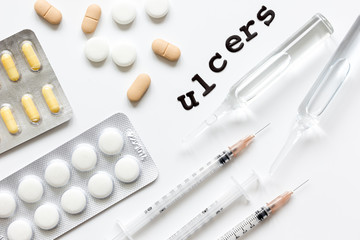 concept - ulcers top view on white background