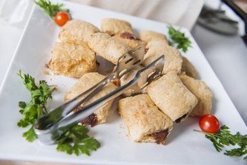 Pastries on a plate. Catering buffet table with a delicious food.