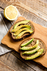 making sandwiches with avocado healthy organic food top view