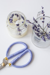 handmade candles with lavender on textile background