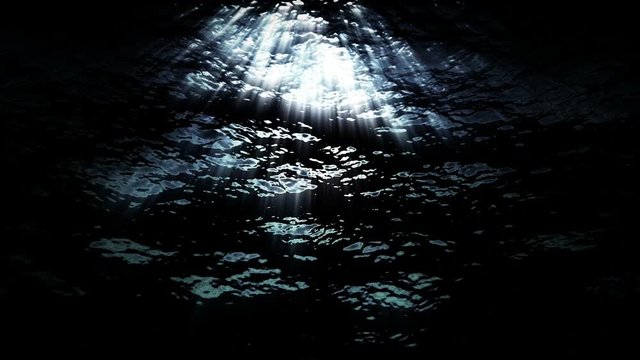 Underwater ocean waves ripple and flow with light rays (Loop).