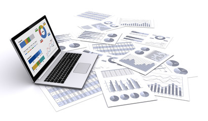 ノートパソコンとビジネス資料