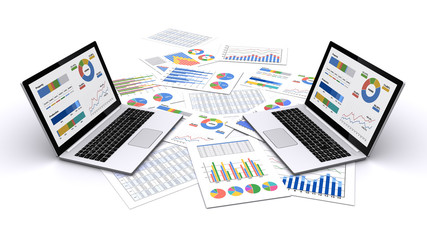 ノートパソコンとビジネス資料