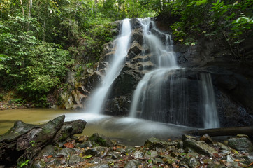 beautiful in nature, amazing cascading tropical waterfall. wet a