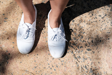 White sneakers on girl legs