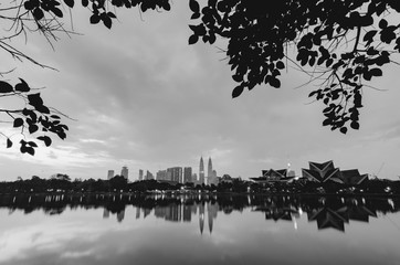 black and white image of Kuala Lumpur City with reflection on th