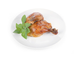 Roasted chicken legs isolated on a white background