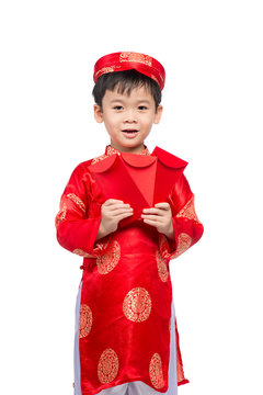 Little Vietnamese boy holding red envelops for Tet. The word mea