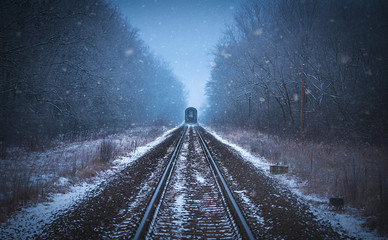 Train tracks in winter mist - 131848115