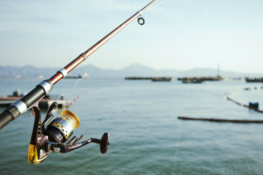 Fishing rod at sea; South Chinese Sea, and Hong Kong S.A.R. in background
