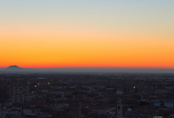 Bergamo - Old city (Citta Alta). One of the beautiful city in Italy. Lombardia. Landscape on the city and Padana plain during the sunrise and a wonderful blu day