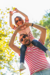 Father and daughter enjoying in the park.