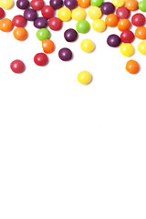 white background with colorful rounded candies on the top
