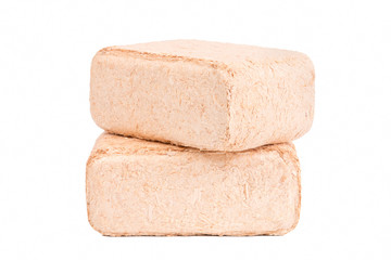 Wood briquettes isolated on white background.