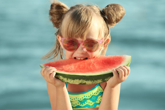 Cute Girl Eating Watermelon On Beach