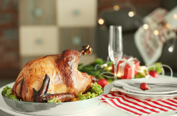 Tasty turkey prepared for Christmas dinner, on blurred background