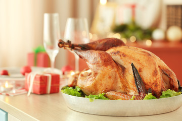 Close up view of tasty turkey prepared for Christmas dinner, on blurred background