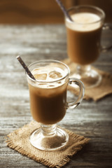 Glasses of cold coffee on table