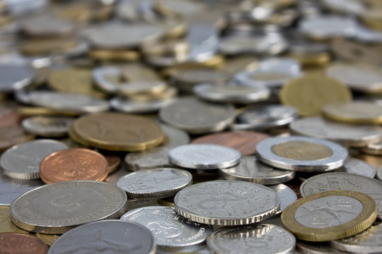 Coins of several currencies. Close up picture taken in studio.