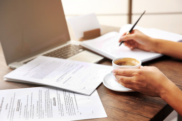 Lawyer sitting at the table with papers