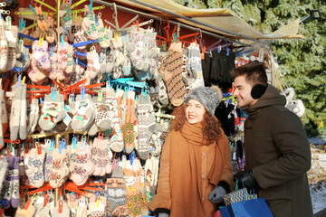 Woman and man shopping on Christmas market