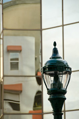 Street lamp building reflections of windows in Little Italy neig