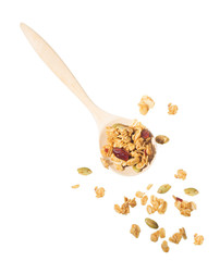 wooden spoon with scatter around healthy granola cereal