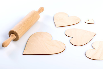 roller and fake wooden heart shaped cookies