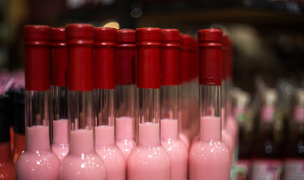 Many Bottles On The Counter In The Store