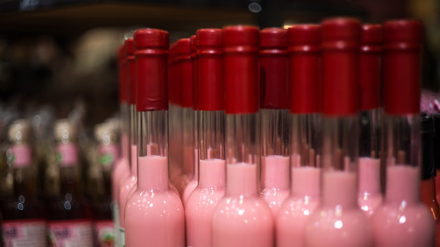 Many Bottles On The Counter In The Store