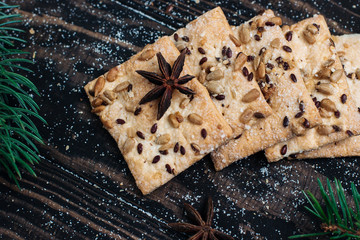 homemade cookies with sesame seeds and sunflower seeds on a wooden background Christmas theme