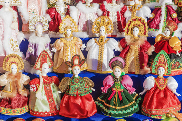 Fototapeta na wymiar Russian souvenir dolls in national costumes