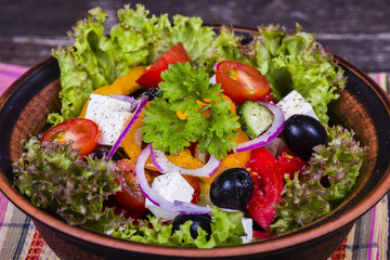 Fresh vegetable greek salad on the table