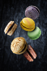 Assorted multi flavoured macaroons floating