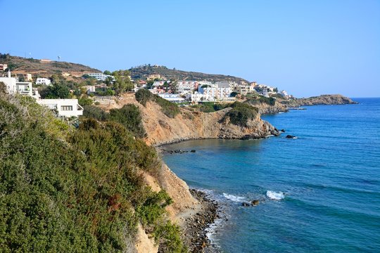 View along the rugged coastline with hotels and apartments to the rear, Bali, Crete.