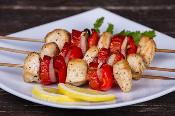 Tasty grilled meat and vegetables on skewer