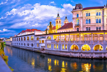 Naklejka premium Ljubljana riverfront architecture evening view