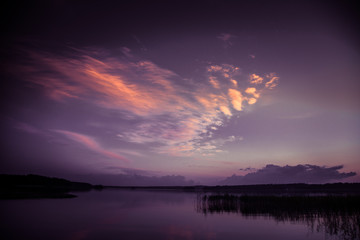 A beautiful, colorful summer sunset over the lake in Finland