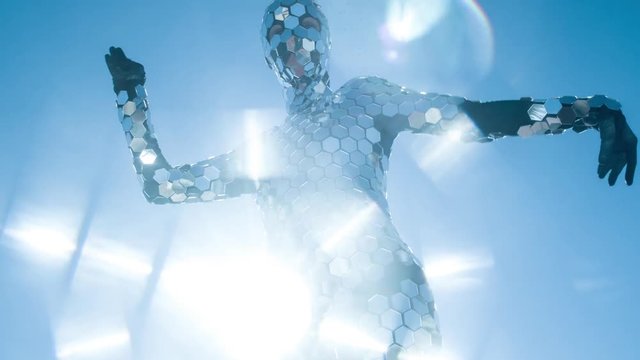 person dancing in amazing discoball mirror suit