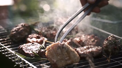 Grill, Frying Fresh Meat, Chicken Barbecue, Sausage, Kebab, Hamburger, vegetables, BBQ, Barbecue, seafood. grilled peppers and onion. Closeup sunny outdoor Chef turns the meat on the grill - Powered by Adobe
