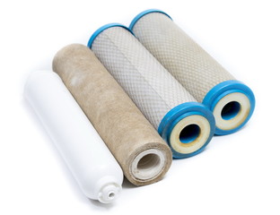 Dirty water filter cartridges on white background