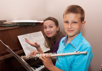 teacher, boy, piano and flute © lozochka