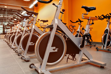 Indoor stationary bikes for spinning cycling classes. a bright o