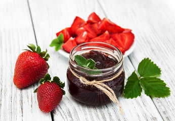 Strawberry jam and fresh strawberries