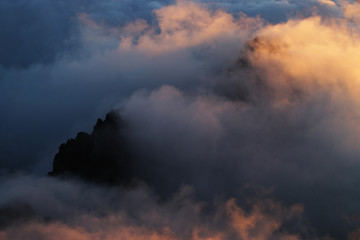 Sunrise over clouds in mountains