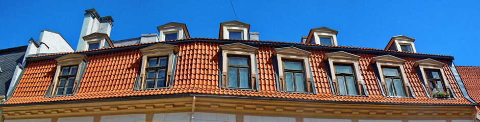 Panoramic view of red roof and dormers (Riga, Latvia) 