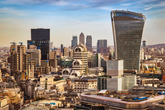 London, England - Bank district and Canary Wharf, the two leading financial districts of the world in central London with famous skyscrapers and other landmarks at golden hour