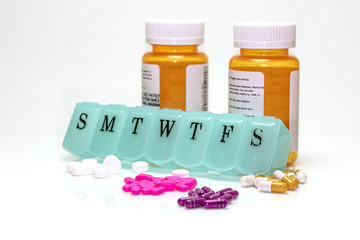 Pill box , Pill Bottles, and Assorted Pills.