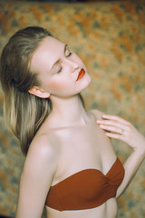 Obraz premium girl with collected hair and red lips. Woman looks very tempting 