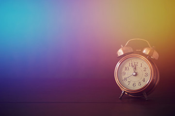 alarm clock on wood table